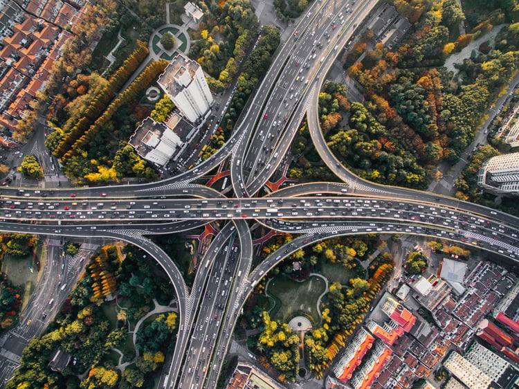 Outstanding aerial view of a busy highway intersection in a metropolitan area. 
