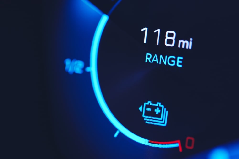 Close-in shot of electric car battery range gauge in blue.